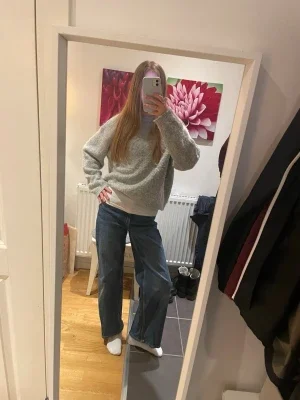Blåa vintage jeans med vida ben