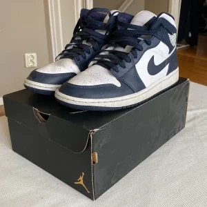 Nike Air Jordans black obsidian mids
