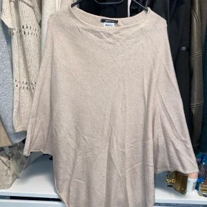 beige poncho