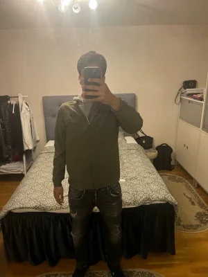 Olivgrön windbreaker från Under Armour