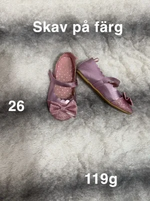 Glittriga rosa ballerinaskor med rosett