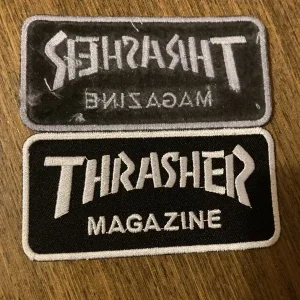 Thrasher logo tygmärke