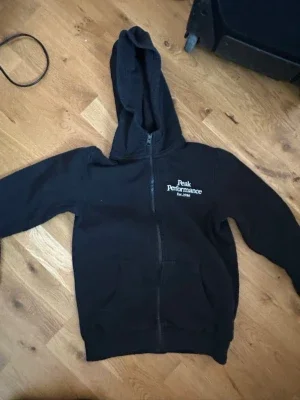 Svart zip-hoodie Peak Performance