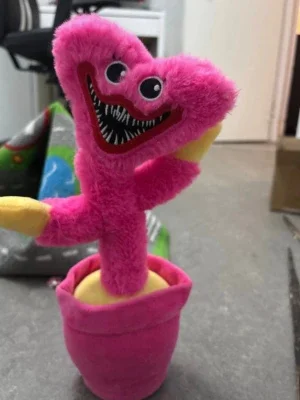 Rosa mjukisdjur monster i kruka