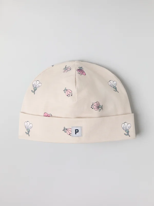 Lue blomstret - 40 - 42 - barneklær - beige - Polarn O. Pyret