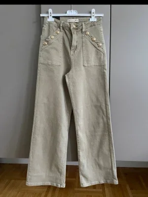 Beige wide leg jeans