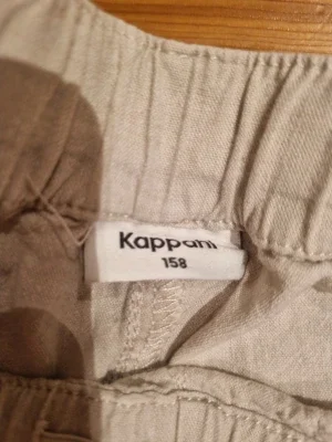 Beige linnebyxor från Kappahl, strl 158