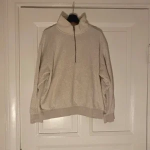 Beige half zip sweatshirt
