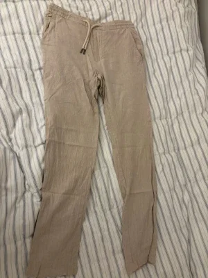 Beige linnebyxor xs