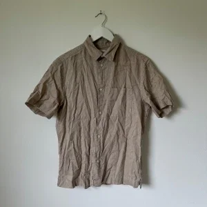 Beige kortärmad linneskjorta H&M