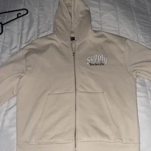 Beige hoodie Supply & Demand NYC