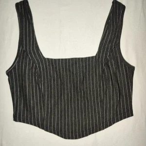 Randig svart korsett topp från Stories