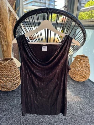 Glittrig topp tajt topp med waterfall ringning