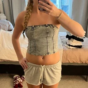 Ljusblå bandeau jeanstopp med dragkedja