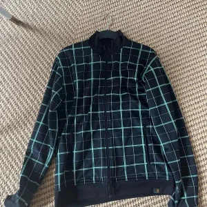 Rutig svart Carhartt Grid jacka L