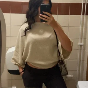 Nelly poncho tröja