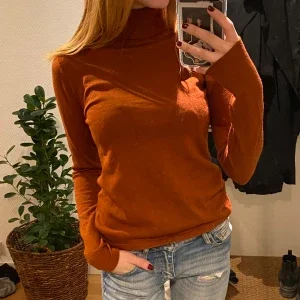 Orange turtleneck