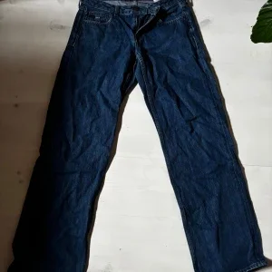 Tommy Jeans low waist raka blå jeans 27/32
