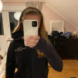 Svart hoodie Peak Performance XS