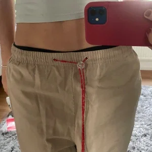 Beige byxor från Le Coq Sportif