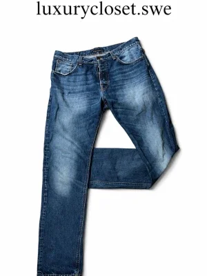 Blå slitna jeans från Nudie Jeans