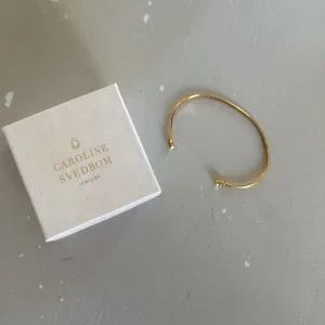 Guldigt armband Caroline Svedbom