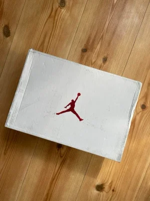 Vita Air Jordan 4 red metallic sneakers